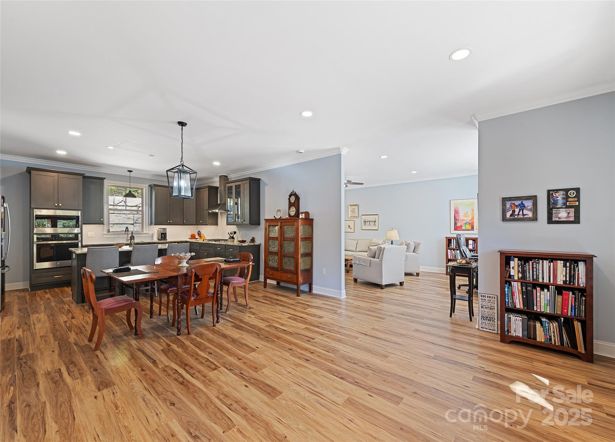 85 Garnet Spg Lane Waynesville, NC 28785 - Photo 6 of 36 a living room with furniture and a dining table with wooden floor