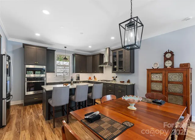a kitchen with a table and chairs in it
