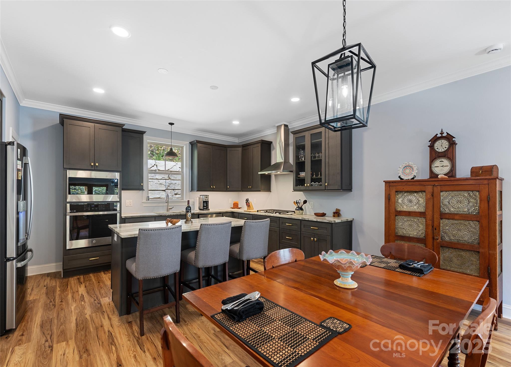 85 Garnet Spg Lane Waynesville, NC 28785 - Photo 7 of 36 a kitchen with a table and chairs in it