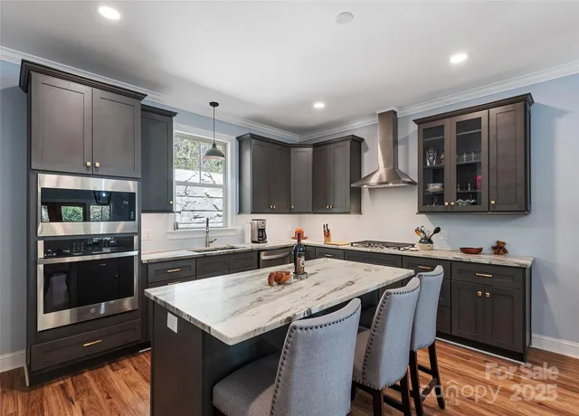 a kitchen with a stove a sink and a refrigerator