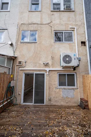 a front view of a house with many windows