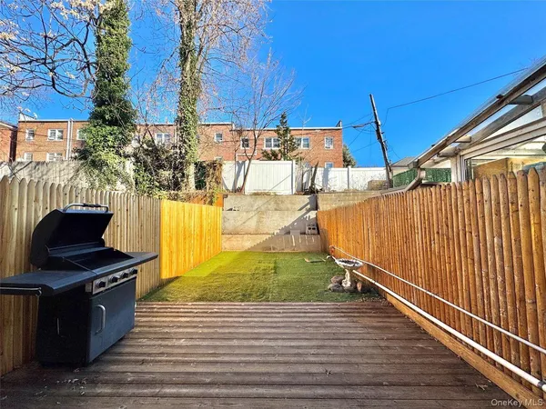 a view of a patio with wooden floor