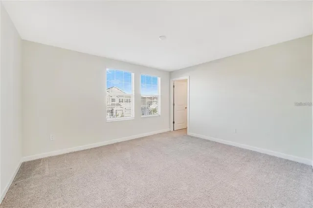 a view of an empty room and window