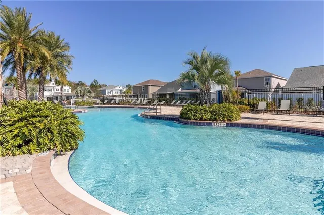 a house with palm trees in front of it