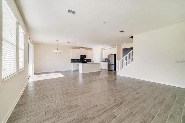 a view of kitchen with furniture and wooden floor