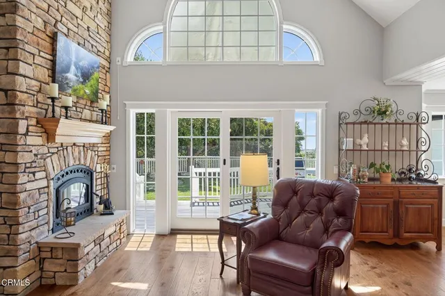 a kitchen with kitchen island granite countertop a large counter space cabinets and stainless steel appliances