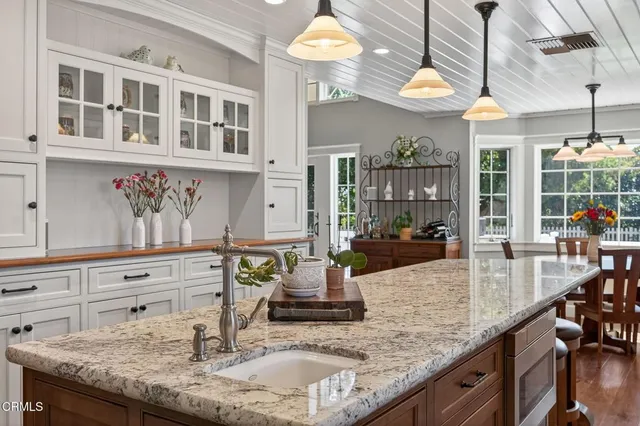 a bedroom with a large bed and a large window