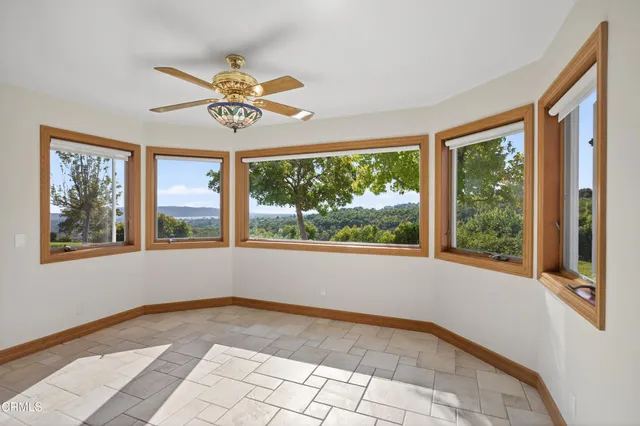 a view of a living room and balcony