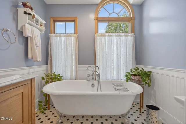 a room with lots of wooden furniture and appliances