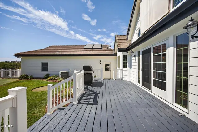 a view of a balcony with wooden floor