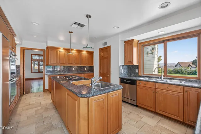 a view of a living room and balcony