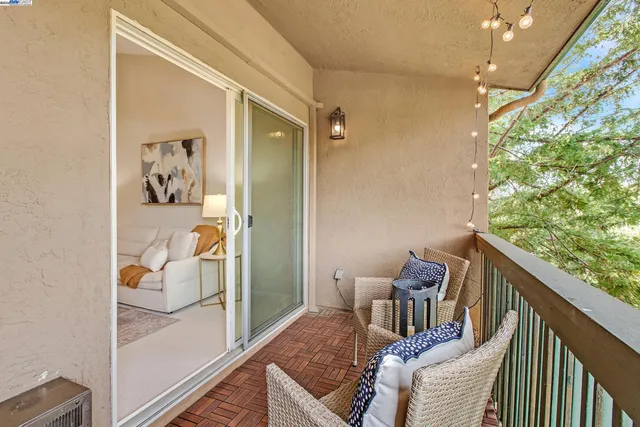 a living room with furniture and a lamp