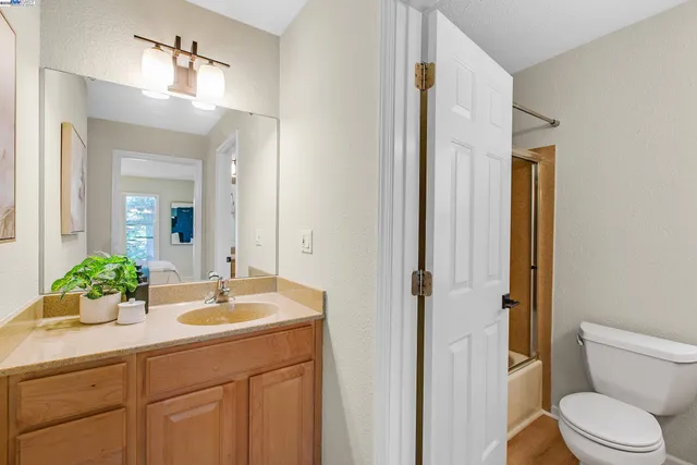 a living room with furniture a clock and a chandelier