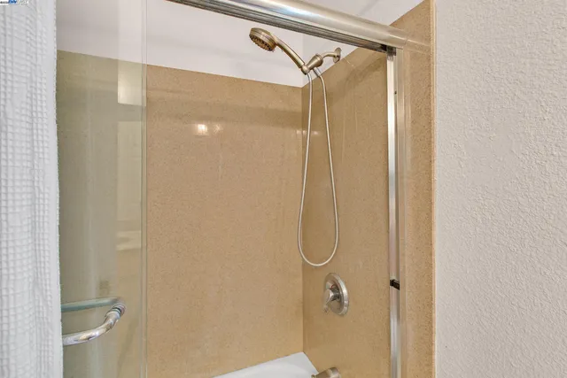 a bedroom with a large bed and a couch