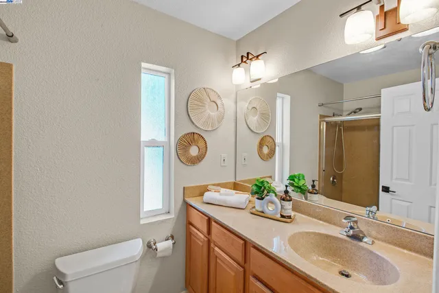 a dining room with furniture and a potted plant