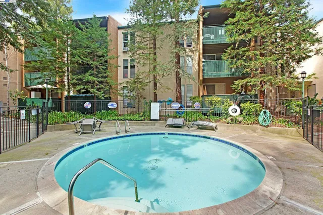 a view of a swimming pool with a patio