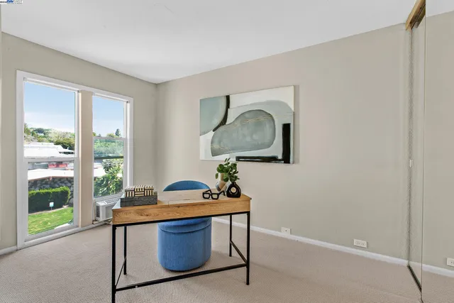 a workspace with furniture and potted plant