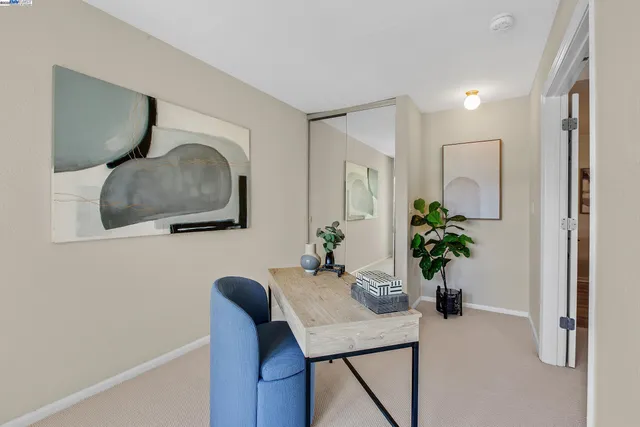 a kitchen with a stove a microwave and wooden floor