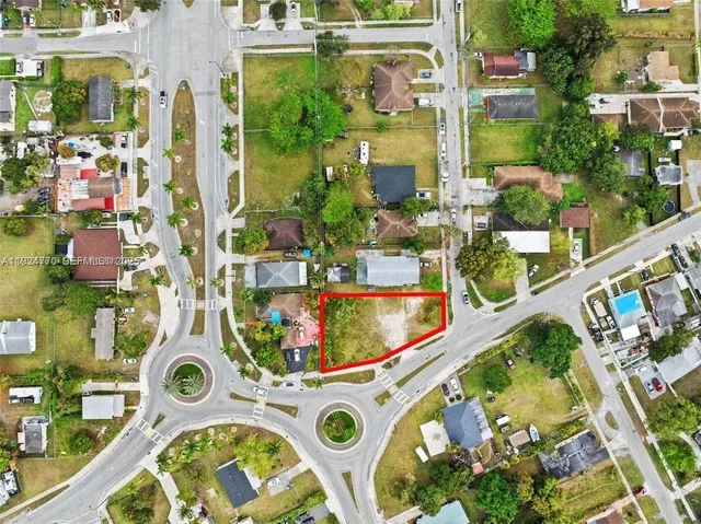 an aerial view of residential house with outdoor space and swimming pool