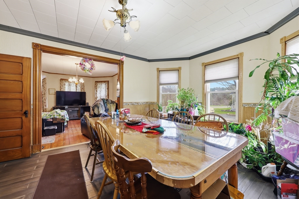 84 Middlefield Road Chester, MA 01011 - Photo 14 of 36 a view of a dining room with furniture window and wooden floor