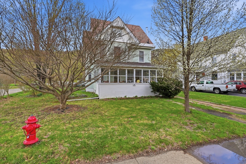 84 Middlefield Road Chester, MA 01011 - Photo 2 of 36 a front view of a house with a yard and trees
