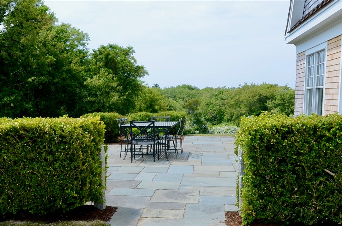 1307 Peckham Farm Road Block Island, RI 02807 - Photo 6 of 32 Secluded stone patio with access from kitchen