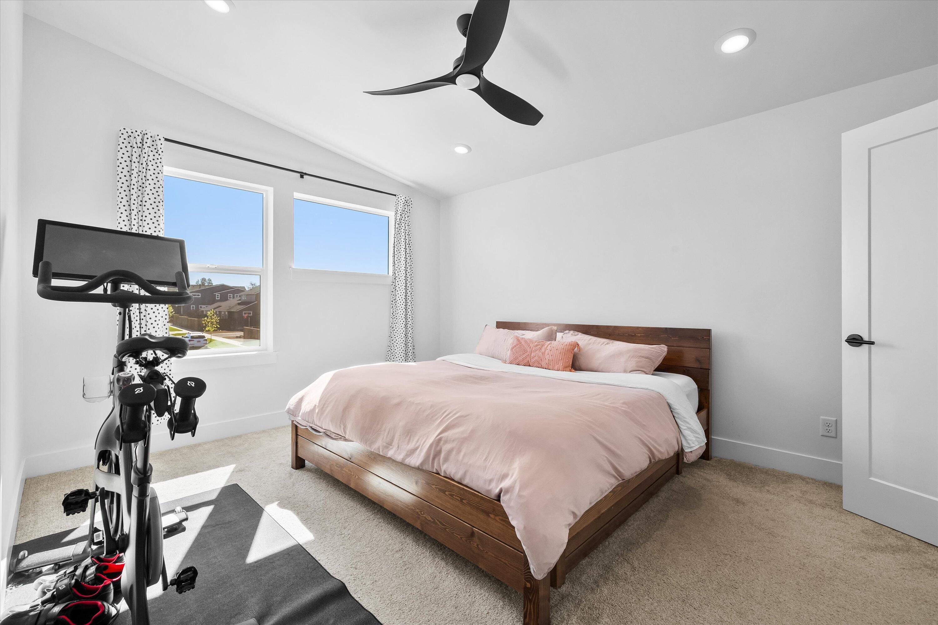 60903 Southeast Epic Place Bend, OR 97702 - Photo 23 of 48 a bedroom with a bed and a flat tv screen on the dresser