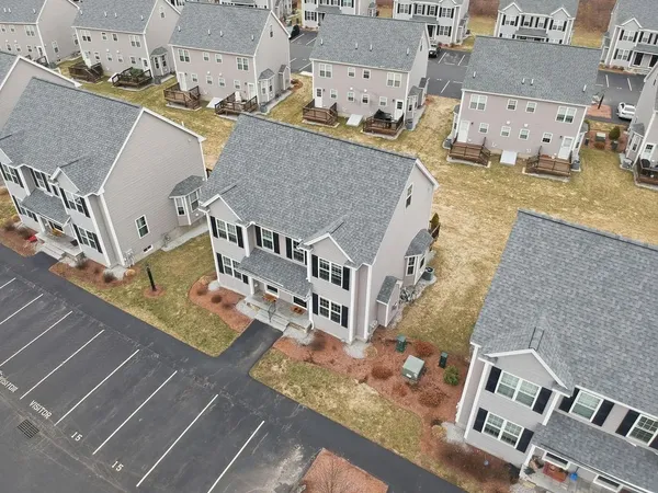 an aerial view of a house with outdoor space