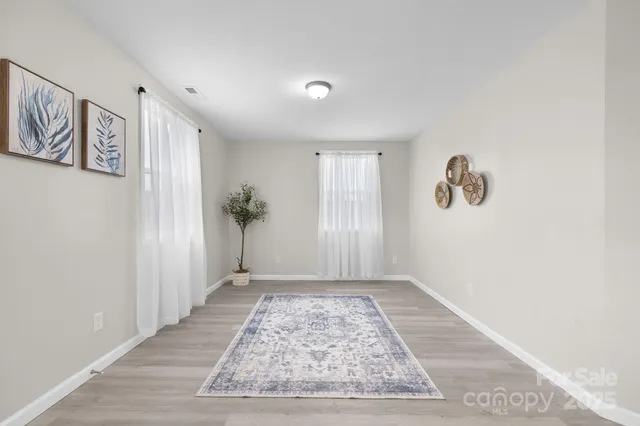 a bathroom with a sink a toilet and shower curtain