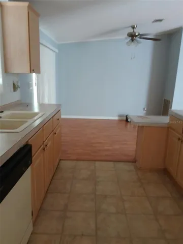 a view of a kitchen with a sink