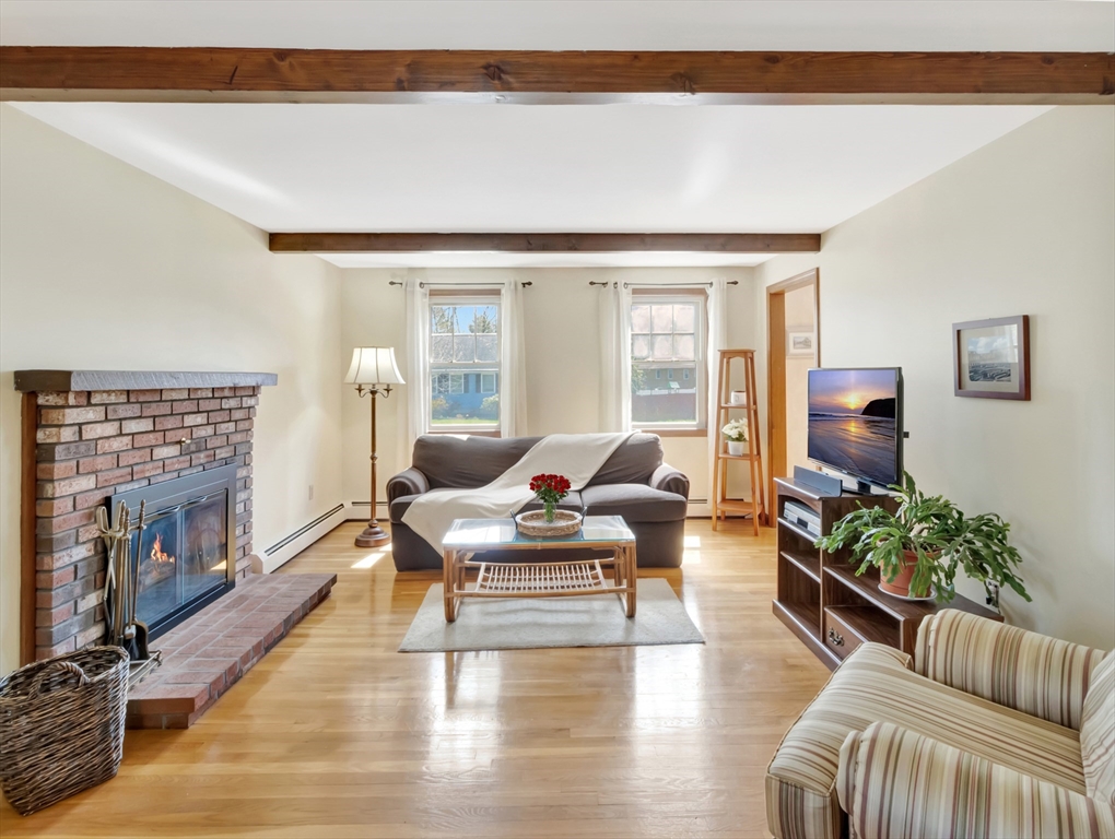 15 Riverside Drive Mansfield, MA 02048 - Photo 2 of 42 a living room with furniture fireplace and flat screen tv