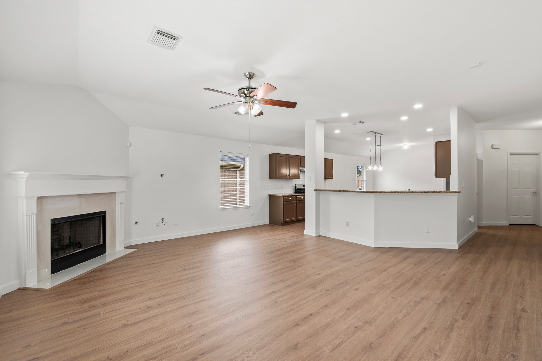 129 Rustic Colony Lane Dickinson, TX 77539 - Photo 14 of 33 Spacious living room with a cozy marble fireplace
