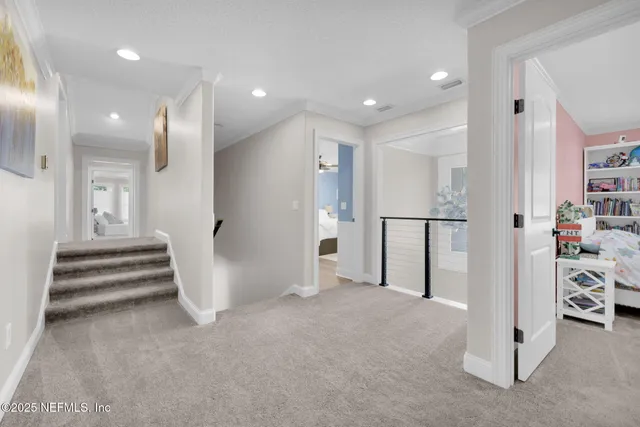 a front view of a house with a garden and plants