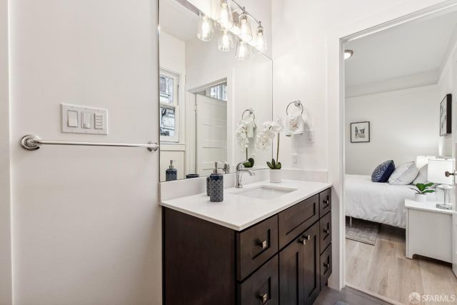 a en suite bathroom with a sink and a mirror
