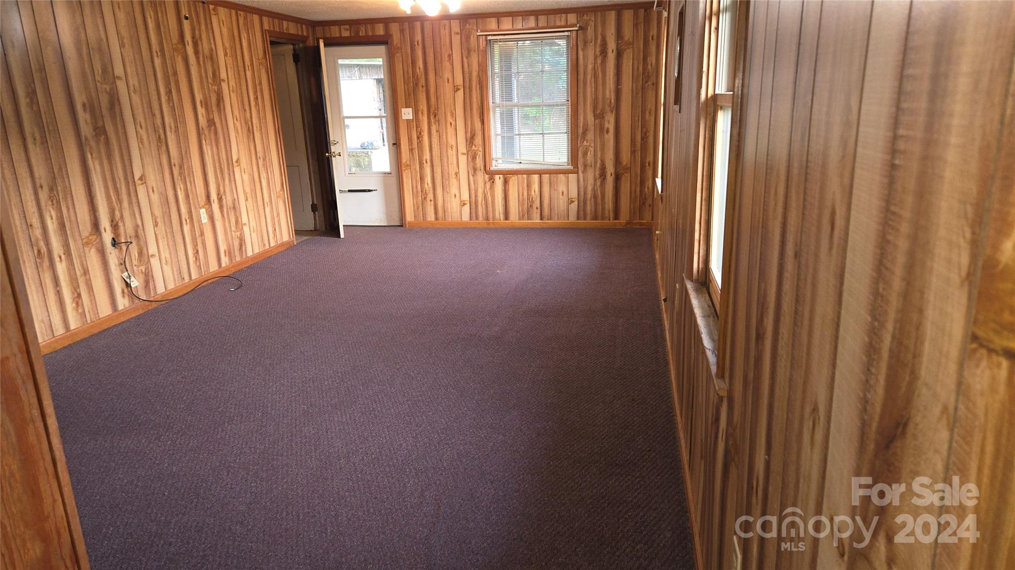 127 Lake Adger Road Mill Spring, NC 28756 - Photo 7 of 20 a view of a closet with windows