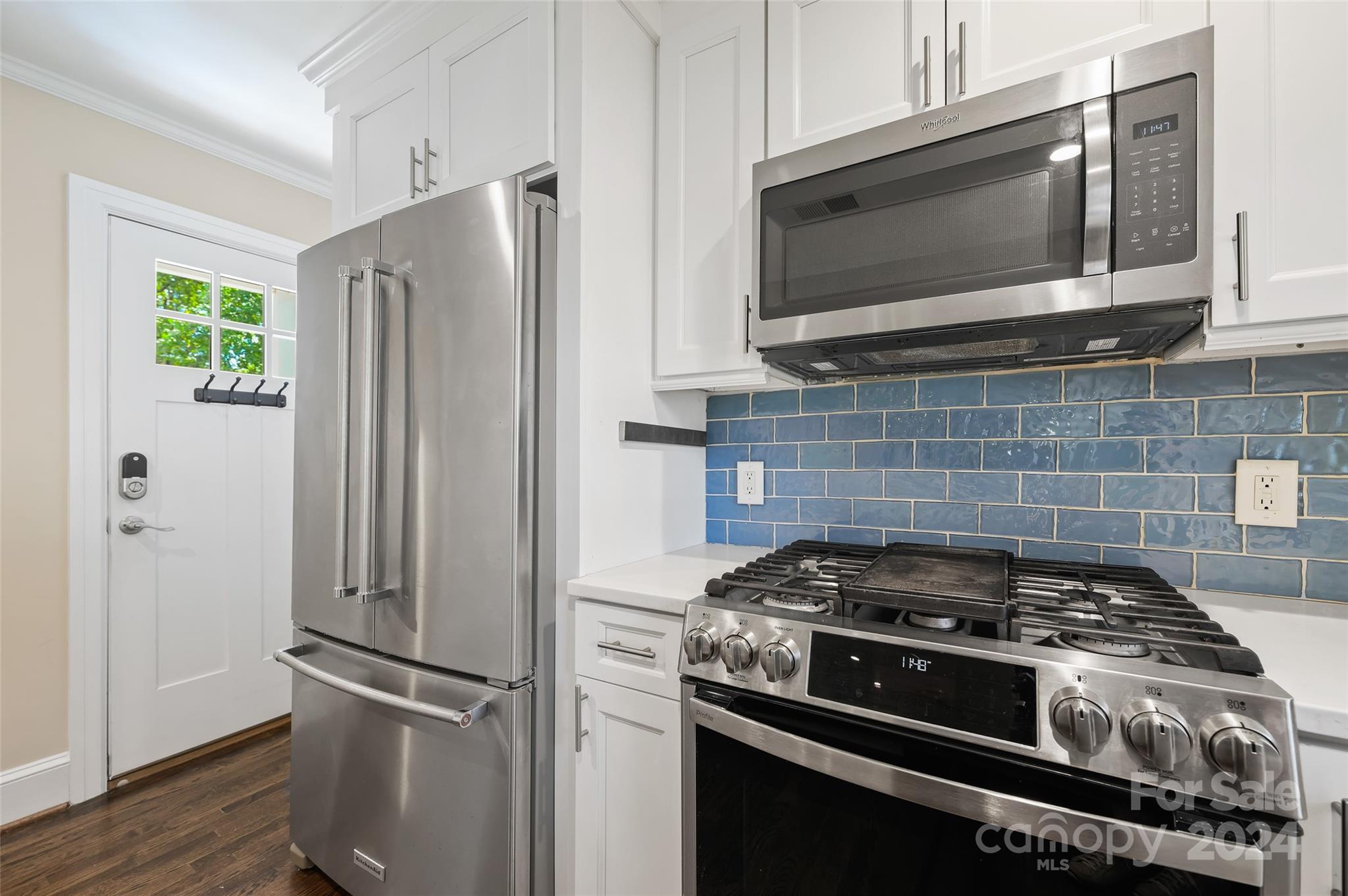 3233 Pinehurst Place Charlotte, NC 28209 - Photo 15 of 39 a kitchen with stainless steel appliances and cabinets