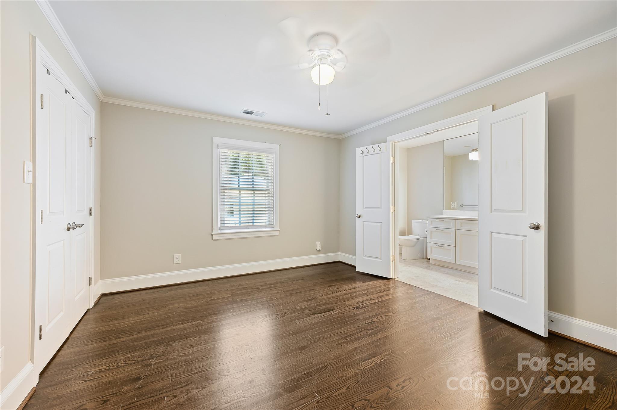 3233 Pinehurst Place Charlotte, NC 28209 - Photo 19 of 39 a view of an empty room with wooden floor and a window