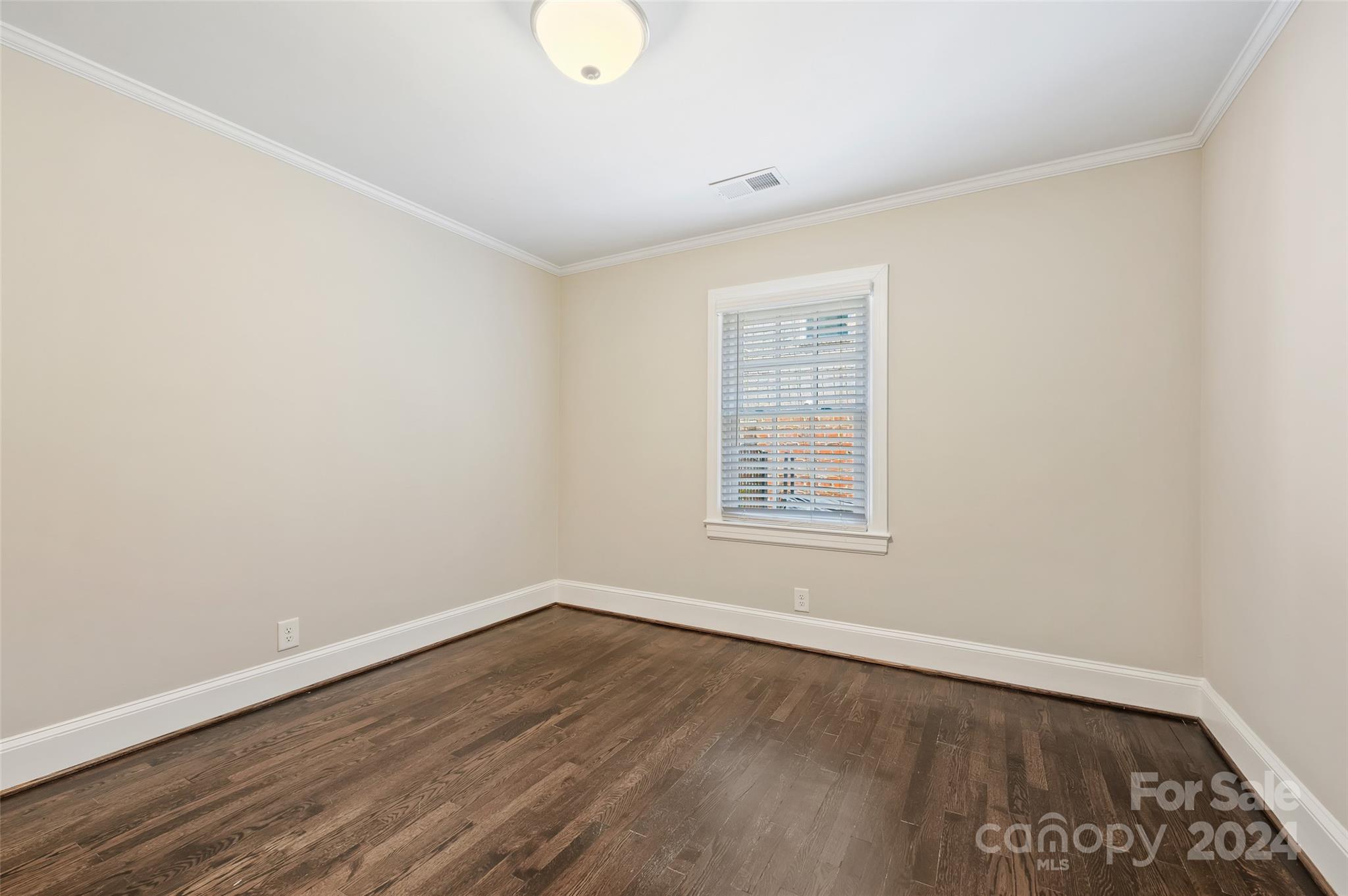 3233 Pinehurst Place Charlotte, NC 28209 - Photo 22 of 39 an empty room with wooden floor and windows