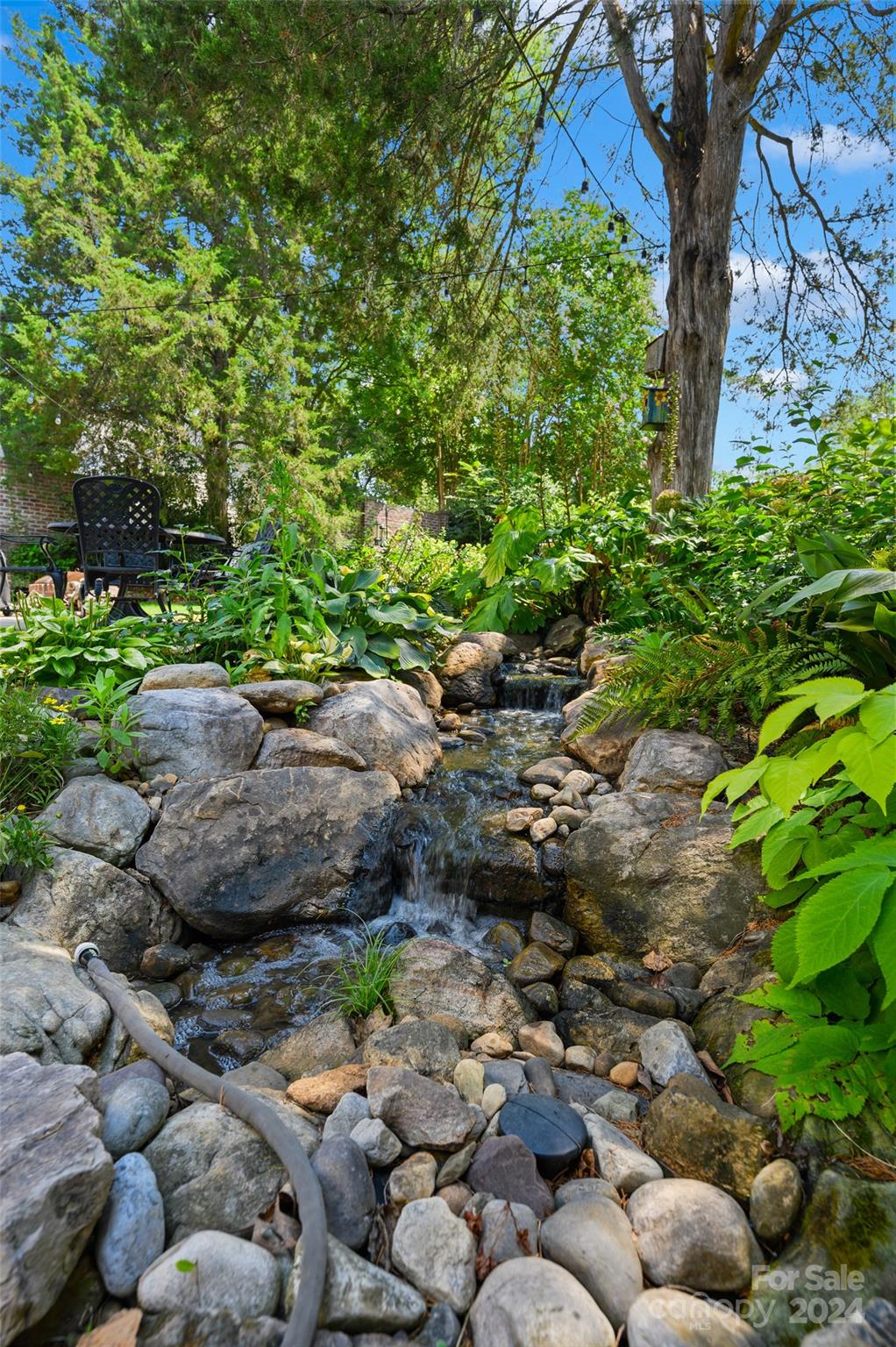 3233 Pinehurst Place Charlotte, NC 28209 - Photo 29 of 39 a backyard of a house with lots of green space