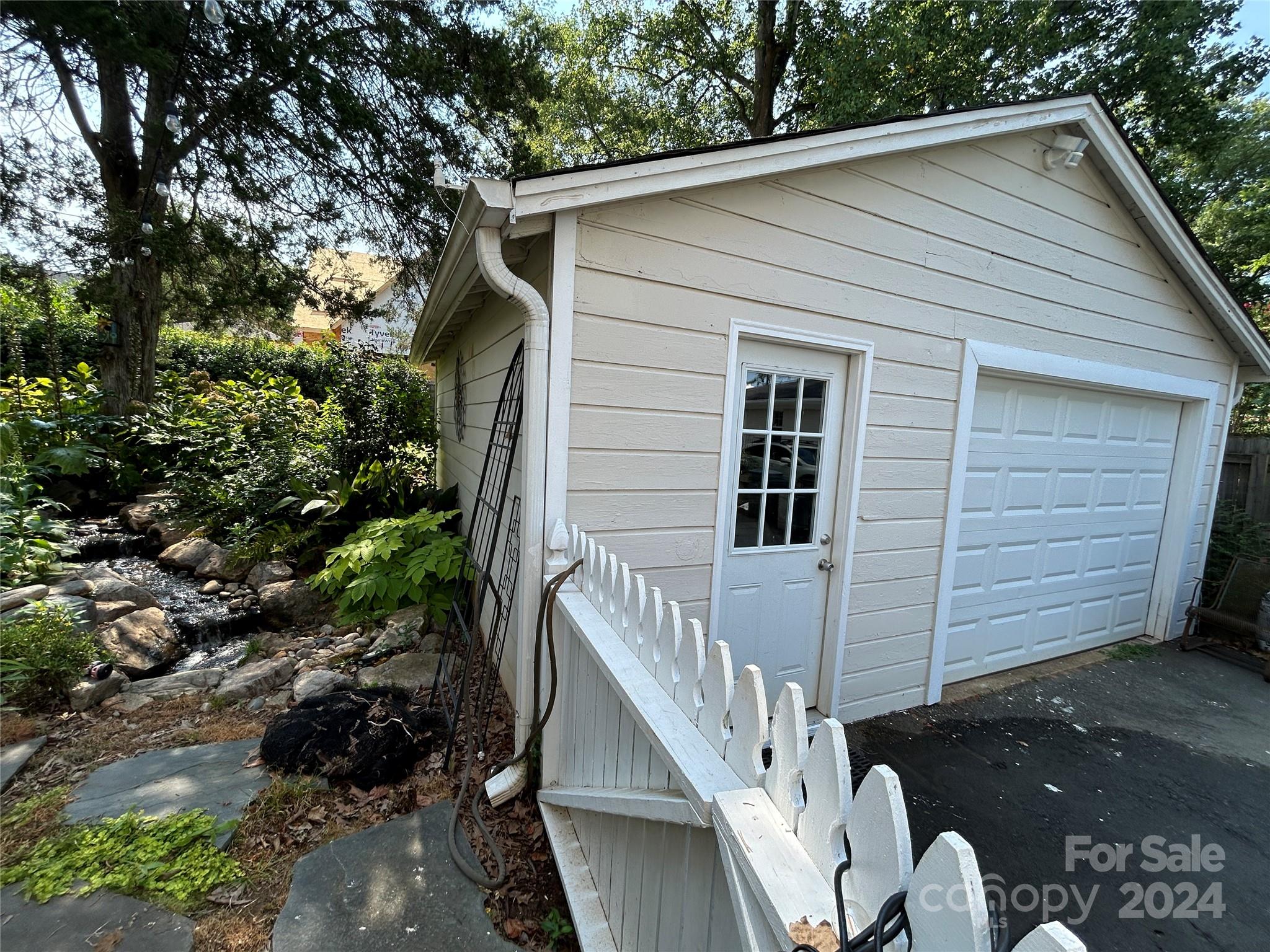 3233 Pinehurst Place Charlotte, NC 28209 - Photo 33 of 39 a view of backyard of house and wooden deck