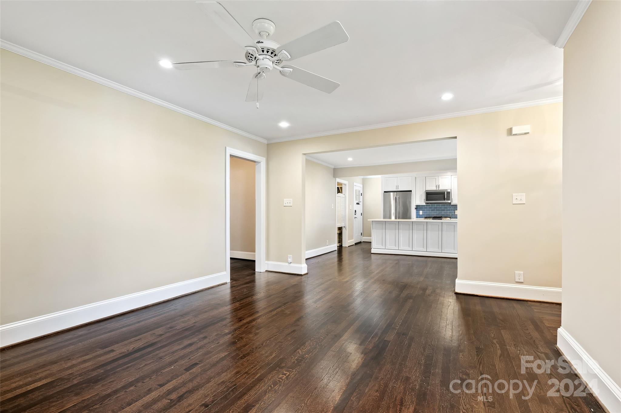 3233 Pinehurst Place Charlotte, NC 28209 - Photo 6 of 39 a view of an empty room with wooden floor