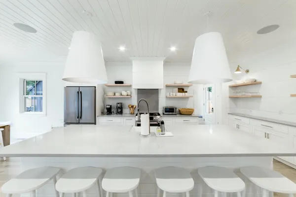 a kitchen with a sink appliances and cabinets