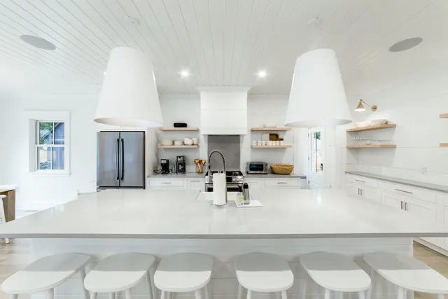 a kitchen with a sink appliances and cabinets