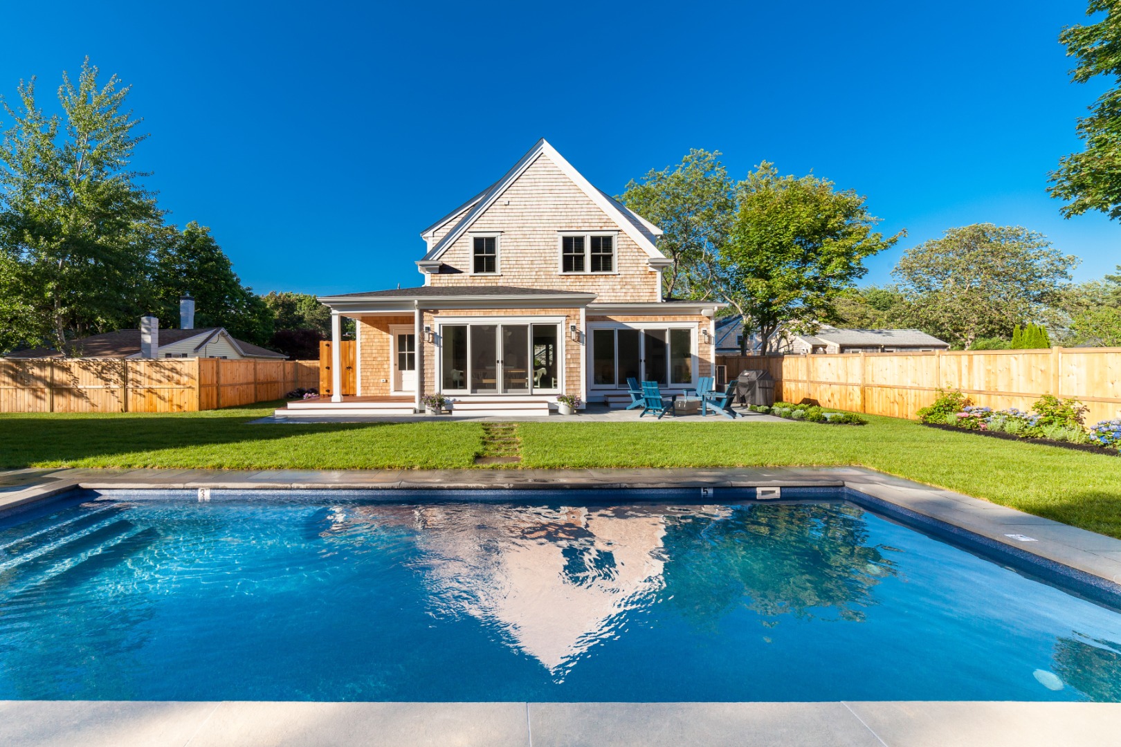 38 Pinehurst Road Edgartown, MA 02539 - Photo 3 of 38 a view of swimming pool with lawn chairs and large trees