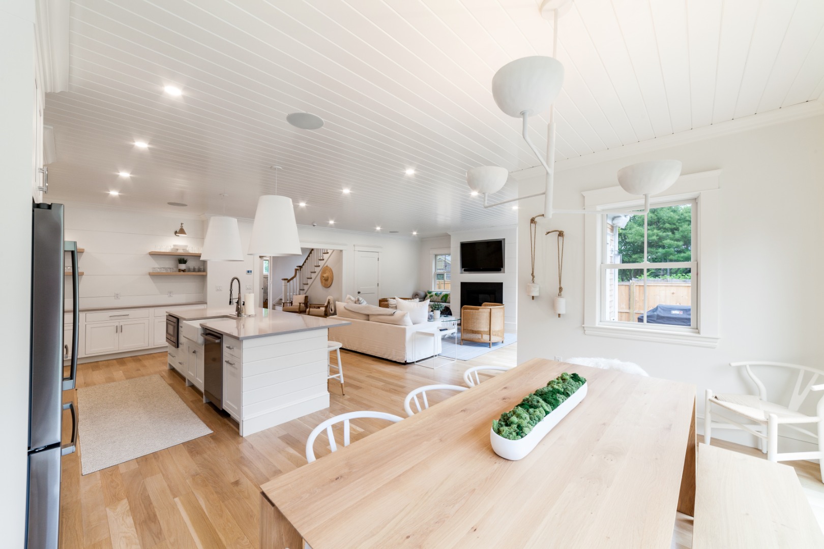 38 Pinehurst Road Edgartown, MA 02539 - Photo 10 of 38 a room with stainless steel appliances kitchen island granite countertop a refrigerator a stove a sink and a dining table with wooden floor