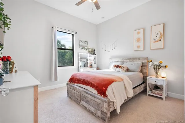 a bedroom with a bed and a table