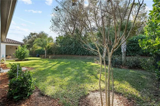 a house view with a sitting space and garden