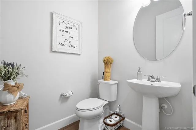 a kitchen with stainless steel appliances kitchen island granite countertop a table chairs and a refrigerator