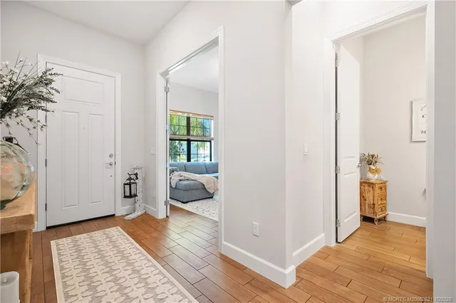 a kitchen with stainless steel appliances white cabinets and a refrigerator