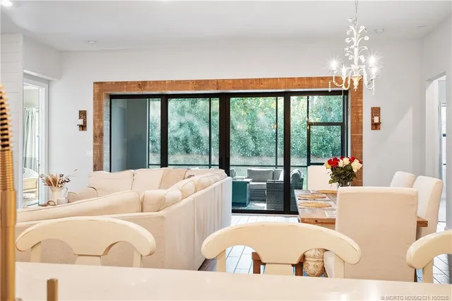 an aerial view of a house with a yard and potted plants